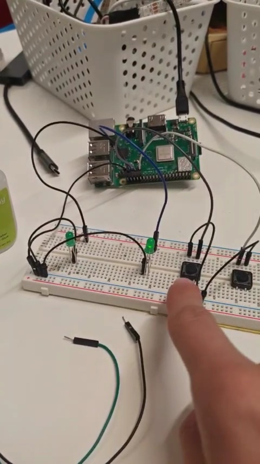 Figure 3&colon; The first working prototype on a breadboard - two buttons switching two LEDs, driven by a short script.
