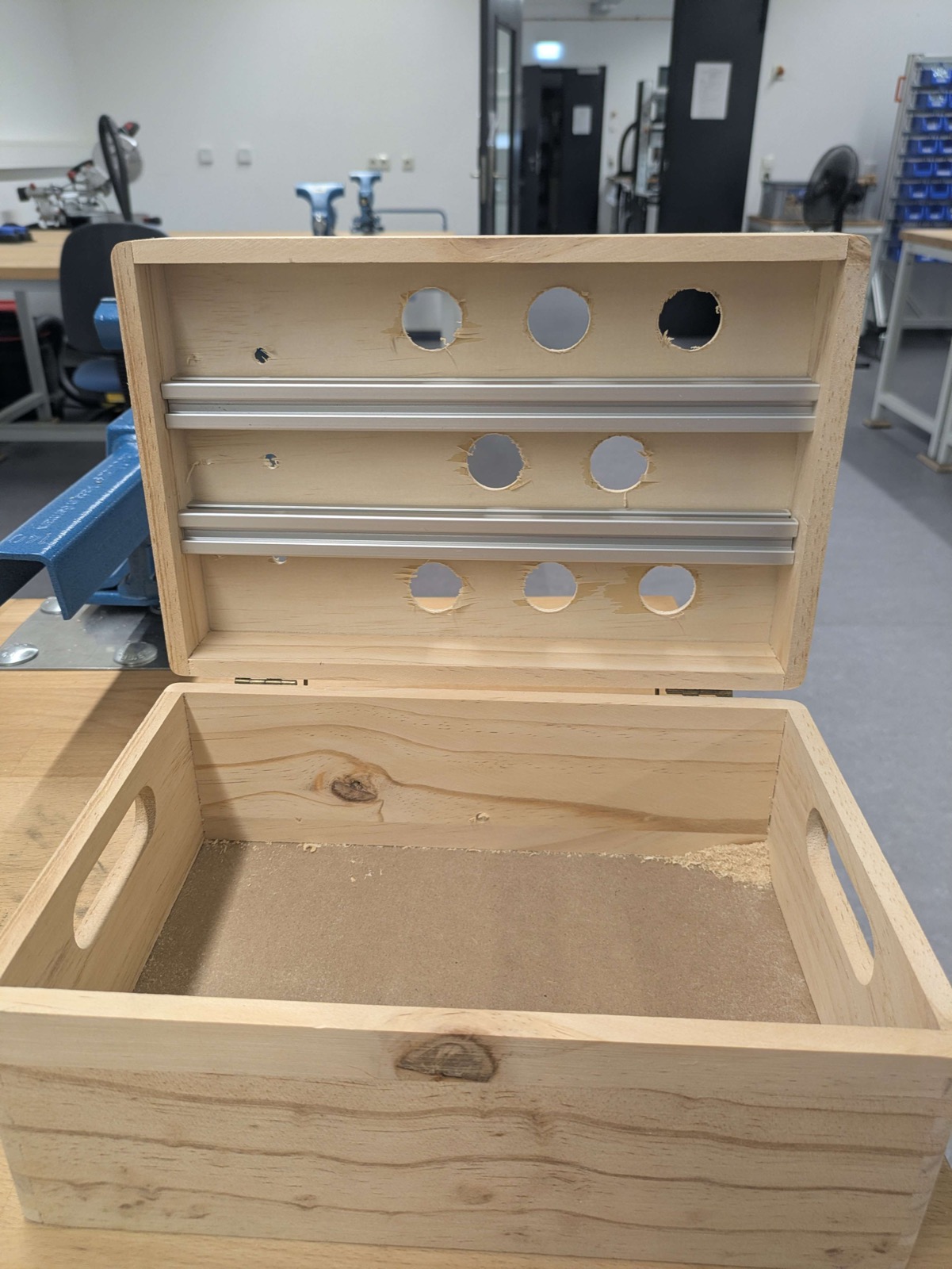 Figure 5&colon; The drilled case with the 3–2–3 hole pattern and aluminium reinforcement.