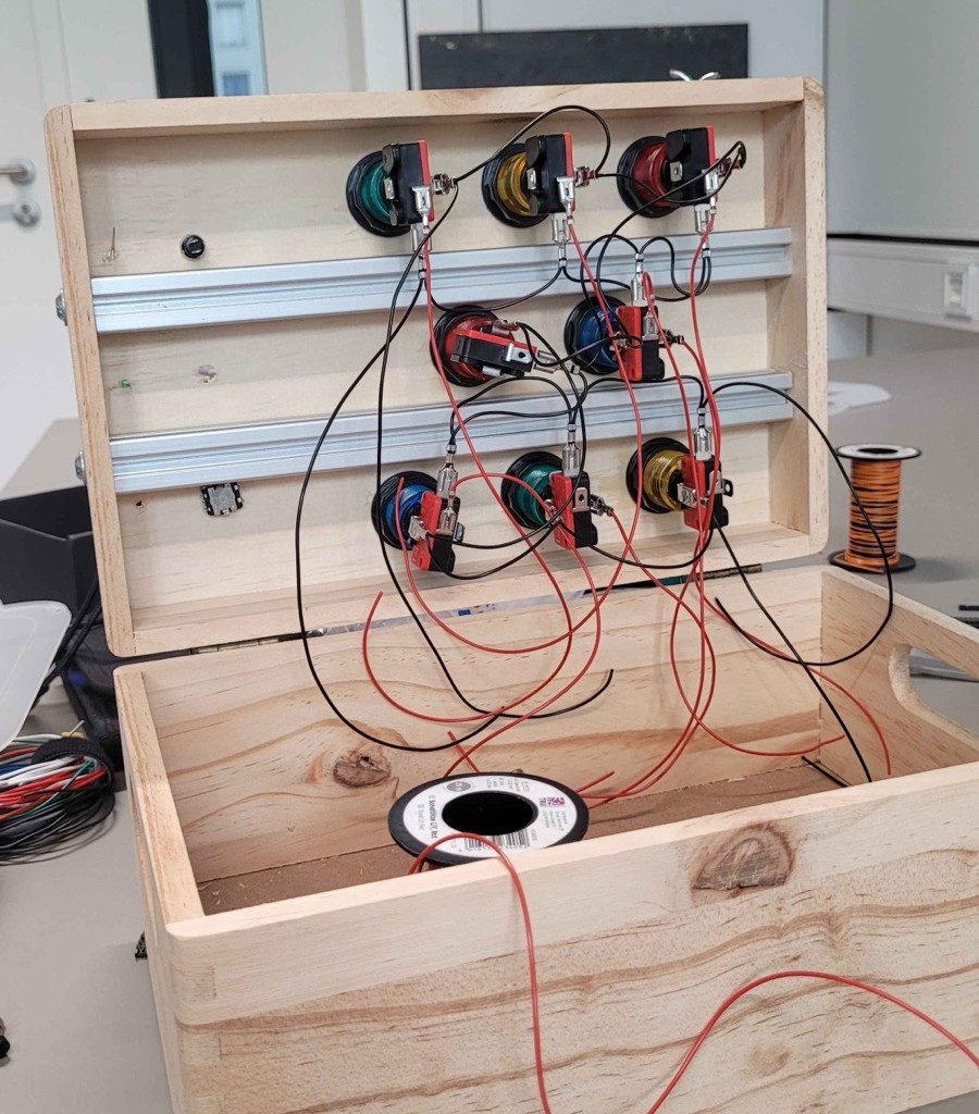 Figure 8&colon; Buttons mounted and wiring in progress inside the case.