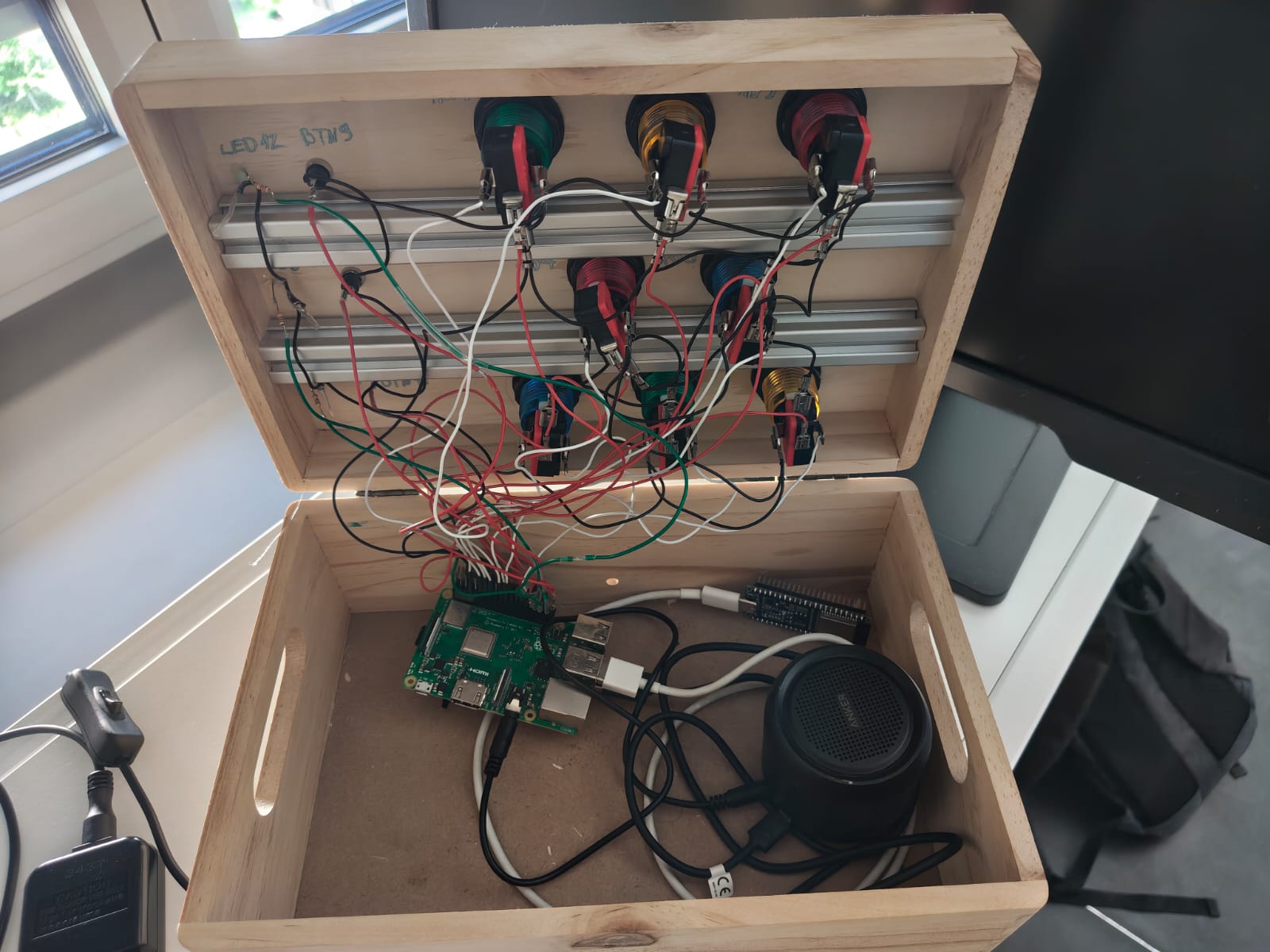 Figure 9&colon; The assembled inside - the Raspberry Pi 3B+ and the speaker below the wired lid.